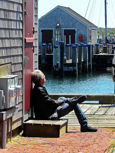 Post image for Man sitting on dock in Nantucket | Picture Massachusetts